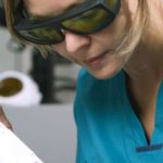 Woman receiving professional laser hair removal treatment in the clinic.