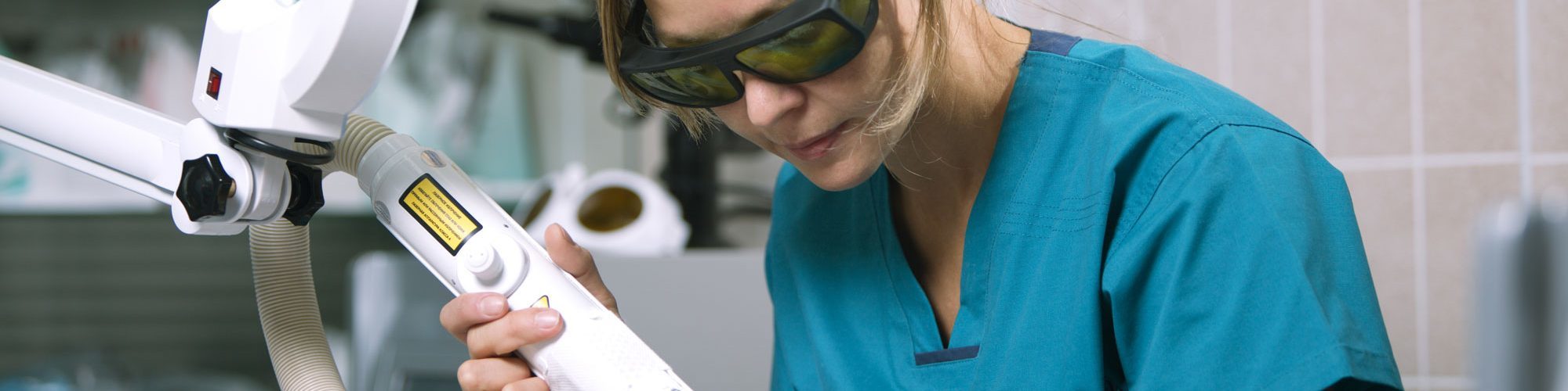 Woman receiving professional laser hair removal treatment in the clinic.