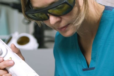 Woman receiving professional laser hair removal treatment in the clinic.