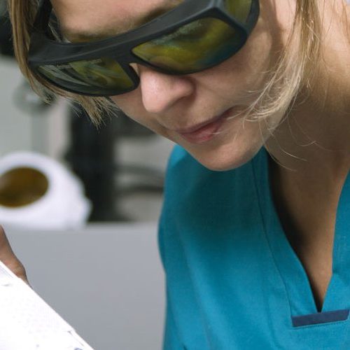 Woman receiving professional laser hair removal treatment in the clinic.